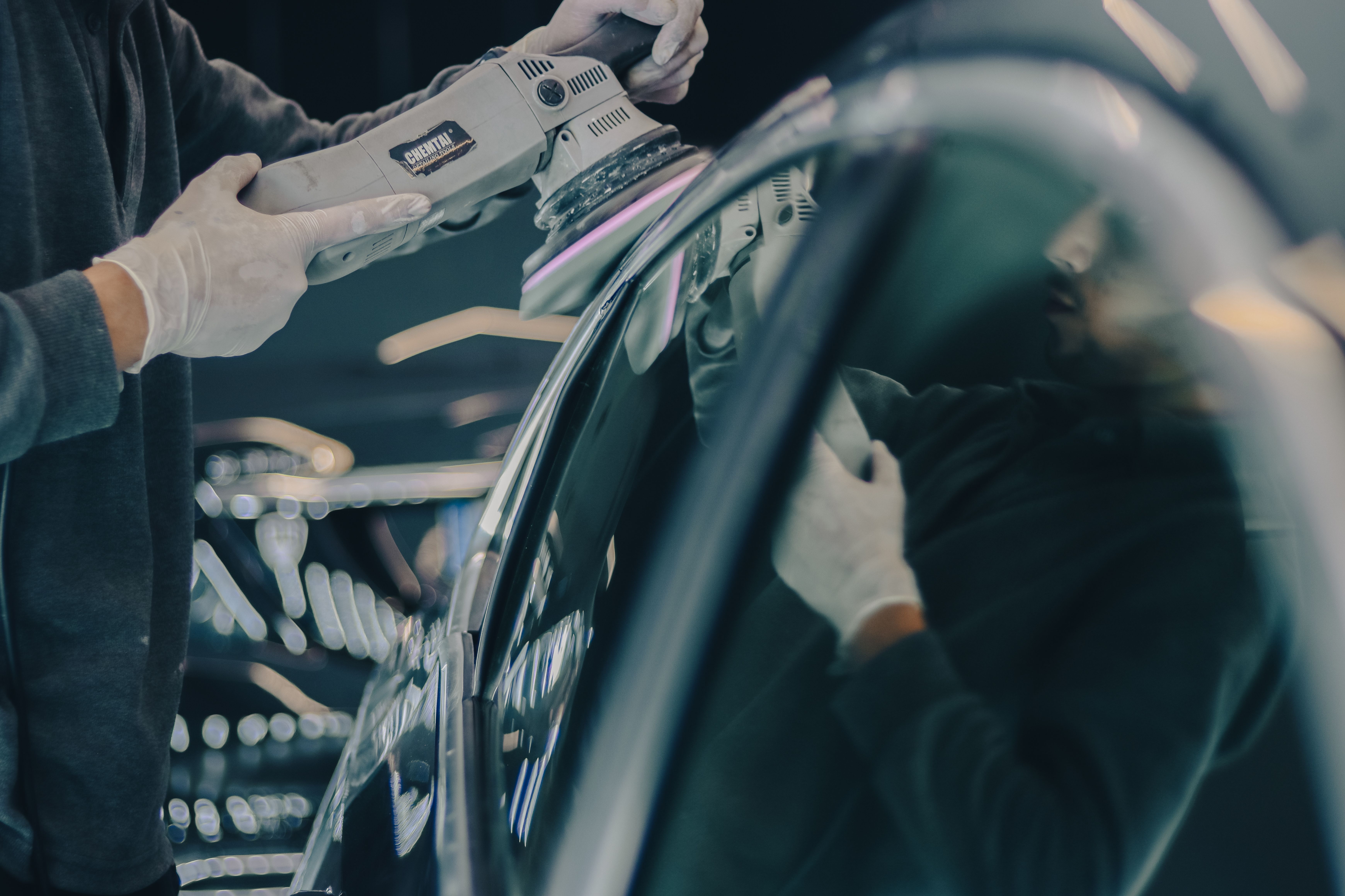 Machine polishing a car paint surface